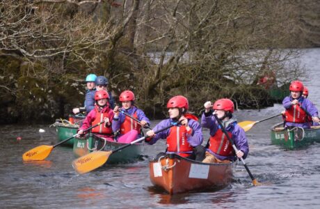 Children canoeing activity on Lake Windermere